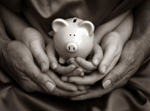 family-budget-piggy-bank-hands